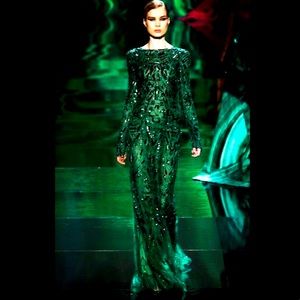 Monique Lhuillier emerald green long sleeve gown.